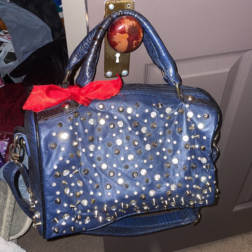Blue vegan bag with studs, spikes and stones zipper on the back side